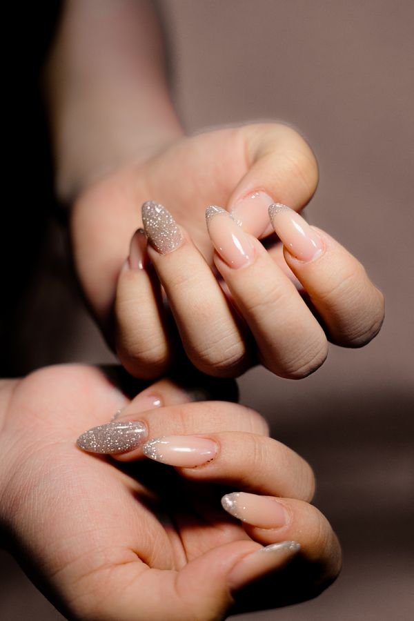 Glossy nude almond nails
